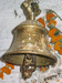 типичный ритуальный колокольчик над входом в храм